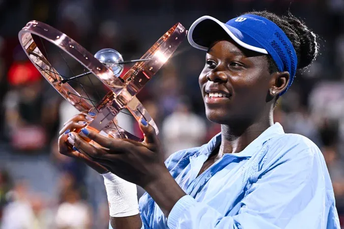 Victoria Mboko celebrates after winning the 2025 National Bank Open title at IGA Stadium in Montreal.